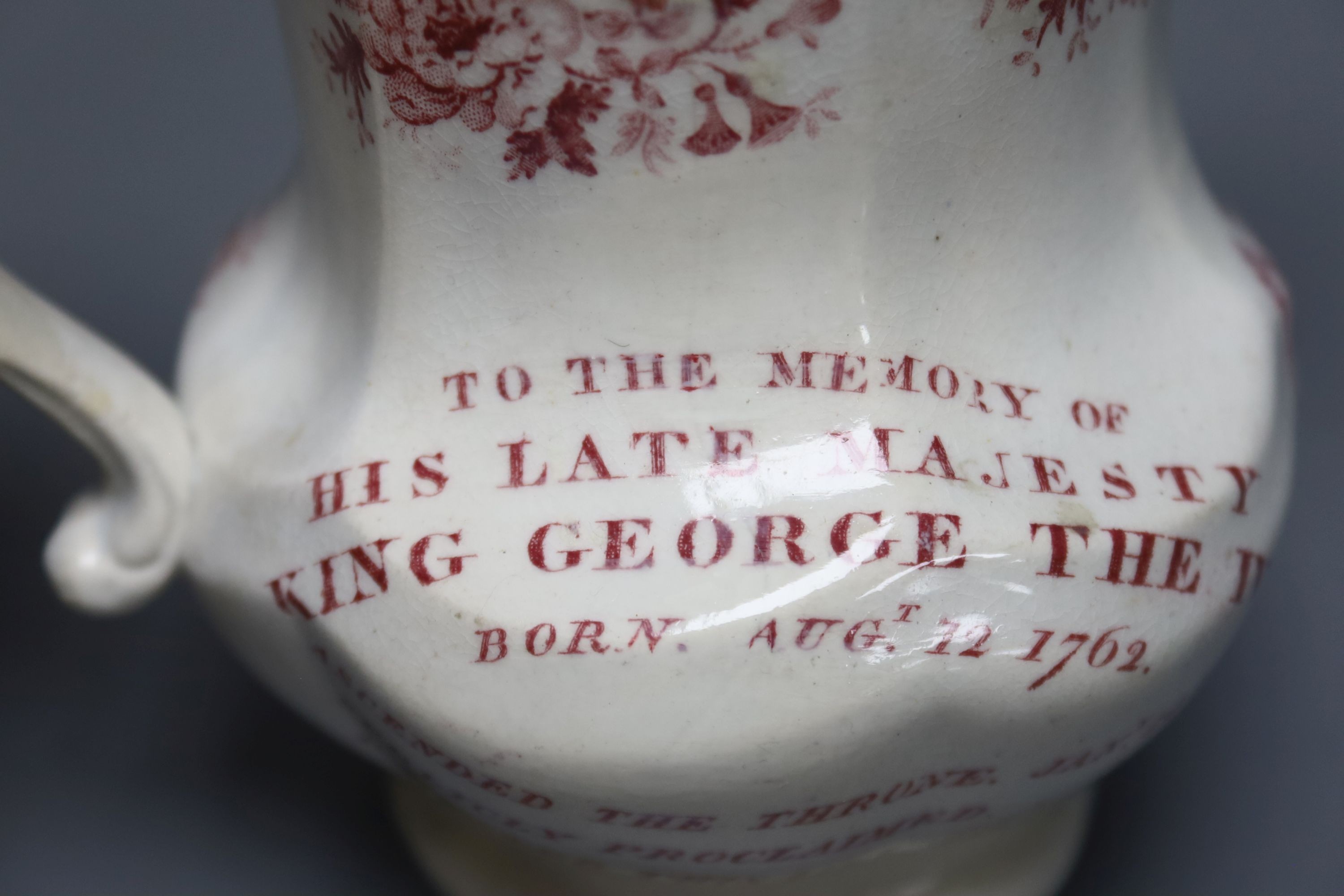 A George IV commemorative pottery jug, 14cm tall